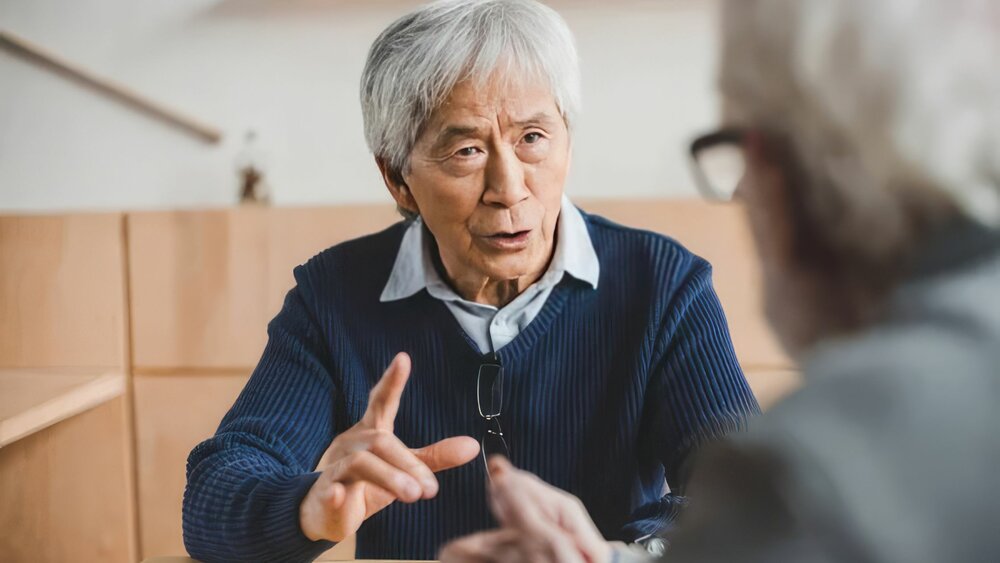 Two people having a thoughtful conversation